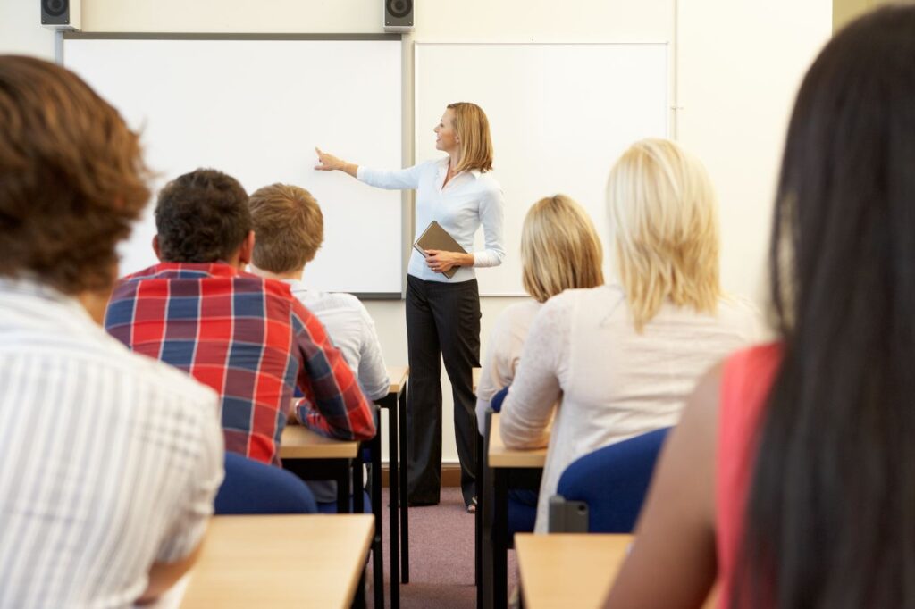 A trainer leading a session with a group of adults